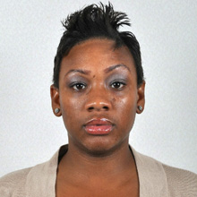  Photo of a woman facing forward with visible eyes and a neutral facial expression.