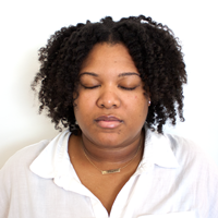 Photo of a woman with her eyes closed.