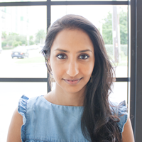 Photo of a woman in front of a window.