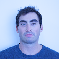Blue-tinted photo of a man.