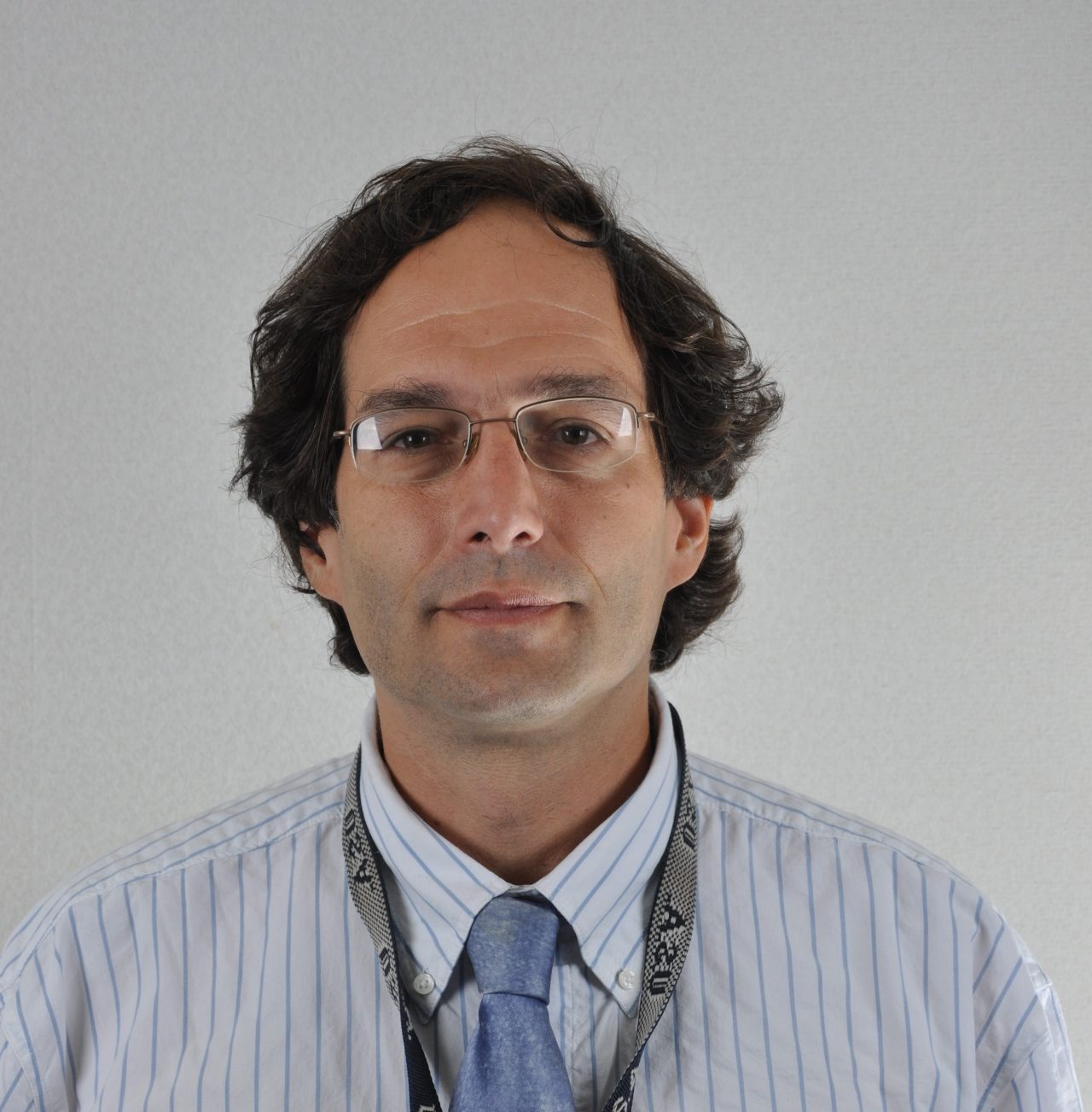 Photo of a man wearing eyeglasses.