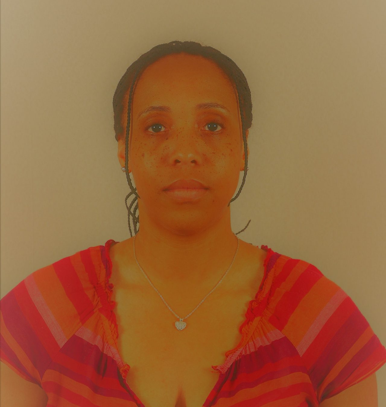 A dim and discolored photo of a woman. 